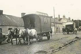 The circus arriving  in Cappamore village, with horse-drawn carts and wagons, drawing in huge crowds upon its arrival