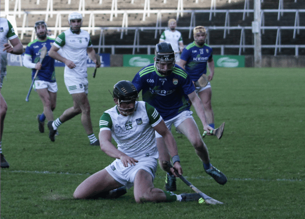 Limerick's Paddy O'Loughlin battles for possession with Kerry's Colin Walsh in the Co-Op Superstores Munster Hurling Cup semi-final at the TUS Gaelic Grounds Pic: Brendan Gleeson