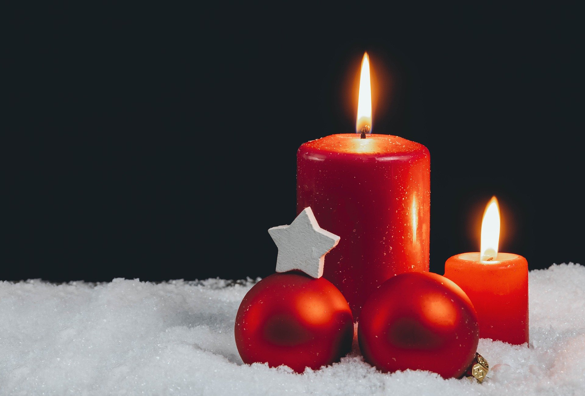 Candles were traditionally placed on  window sills  to guide and welcome wanderers on Christmas