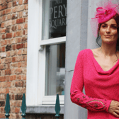 This cerise cowlfront dress with hand-beaded and embroidered sleeve detail would be glorious at a winter wedding