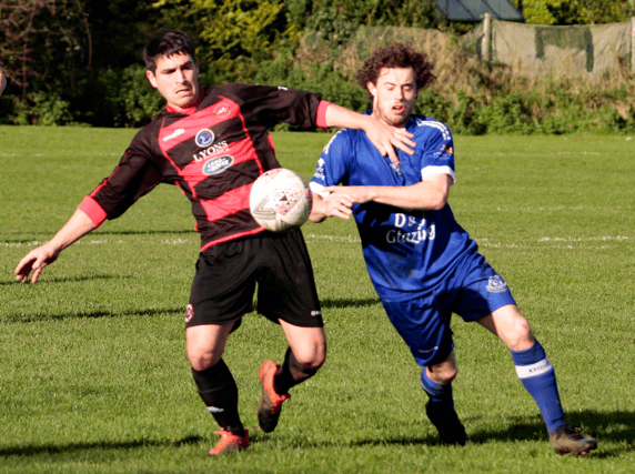 Patrick Ahern, of Mungret Regional, battles for possession with Liam Byrnes, of Ballynanty Rovers, in their FAI Junior Cup tie on Sunday Pic: Brendan Gleeson