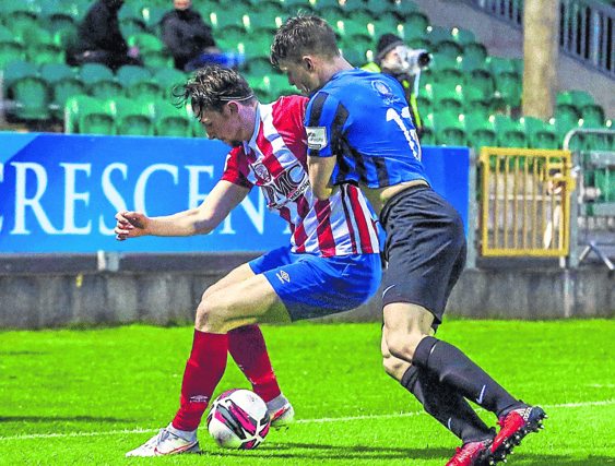 Treaty United's Matt McKevitt holds off David Brookes, of Athlone, in their First Division game at the Markets Field earlier this season Pic: Kieran Ryan-Benson