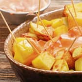 The word "tapas" is derived from the Spanish verb tapar, "to cover"