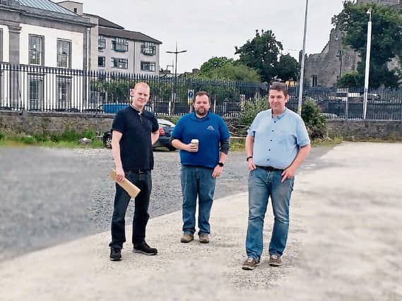 Milk Market manager David Fitzgerald discusses the potential of a solar powered car port in the Potato Market alongside Ronan Murphy, Metaltech and Kieran Reeves, Limerick City and County Council