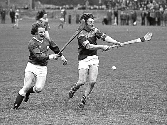 Eamonn Grimes successfully hooks Eddie Walsh during a league match against Wexford in 1979