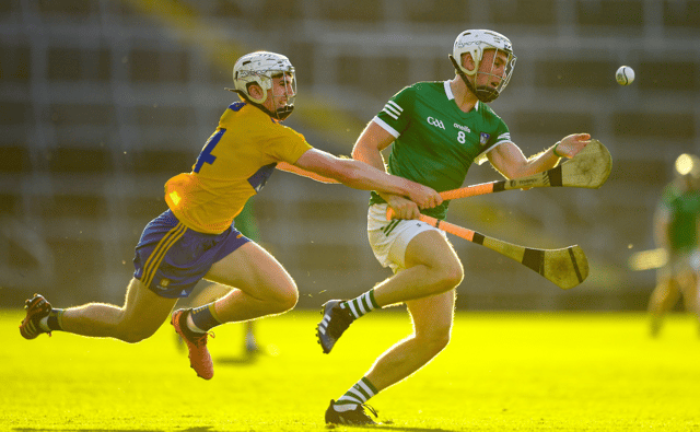 Limerick captain Jimmy Quilty wins possession ahead of Robin Mounsey. PIC: Sportsfile