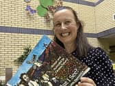 Author and illustrator Caroline Hyland with the front cover of the book