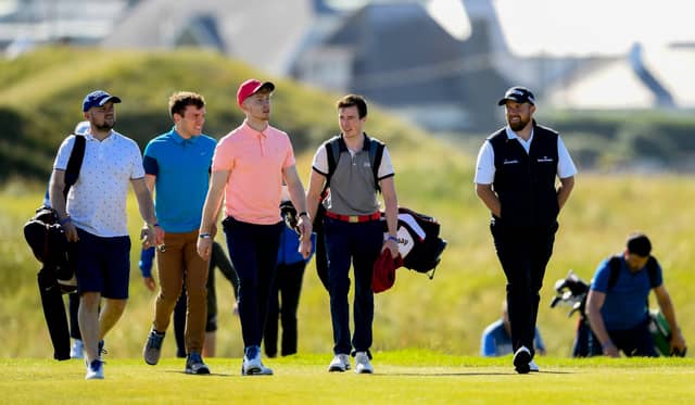 Limerick hurler Cian Lynch, front, centre, with Shane Lowry, right, and Clare's Shane O'Donnell, blue top, during the Pro Am at the Dubai Duty Free Irish Open at Lahinch