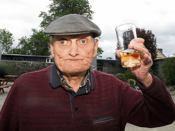 Lovely! Ballybrown man Gilbert Smith, who turns 97 next week, enjoys his first glass of Paddy’s whiskey in Punch’s Bar, Patrickswell since March 2020 | PICTURE: BRENDAN GLEESON