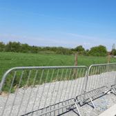 A semi-permanent macadam surface is to be laid