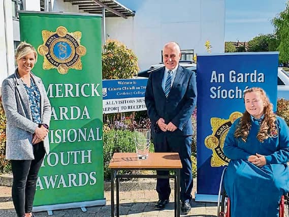 Garda Marion O'Grady with award recipient Amy Mulcahy and Padraig Flanagan, principal of Castletroy College