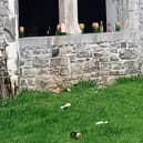 Used bottles and cans discarded on a ledge at the Abbey in Kilmallock