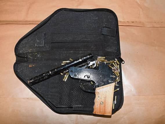An improvised firearm and 88 rounds of ammunition were seized