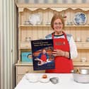 Moira Hillard, 93, a resident of The Park Nursing Home in Limerick, pictured with the new book, which contains one of her recipes