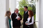 Robert Fisk talking to UL journalism students: Kelly O'Brien, Kieran Walsh and Orla Walsh at the University of Limerick before the lecture