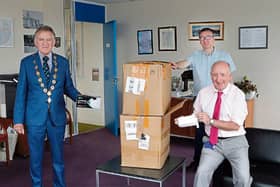 Mayor Michael Sheehan is photographed above with Paul Moore and John Doyle of the H&S PPE team with part of the consignment | PICTURE: LIAM BURKE/PRESS22