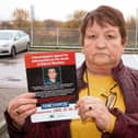 Majella Sheehan holds a flyer appealing for information on her son's death