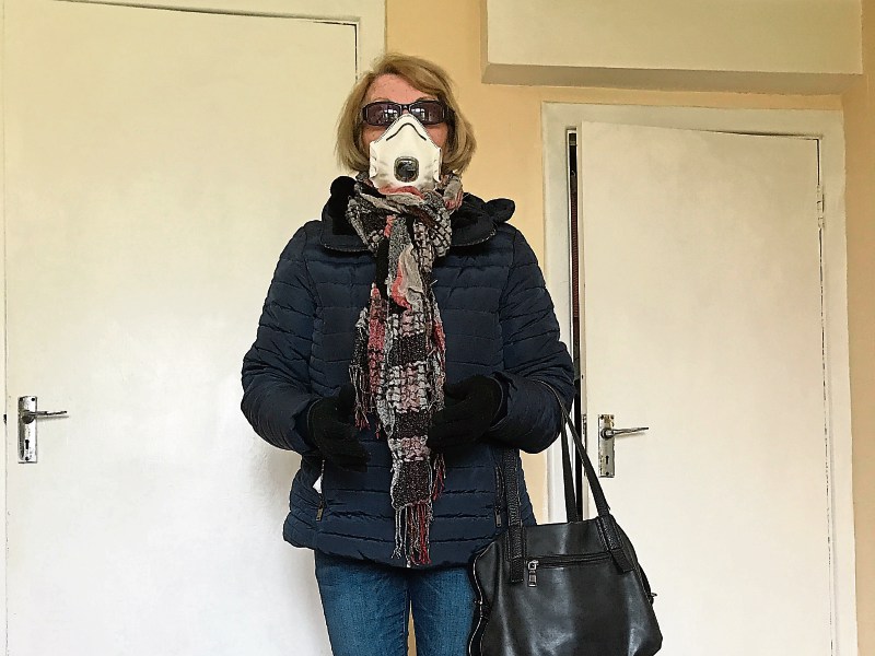 Bridie McMahon demonstrating the precautions she is taking before going out