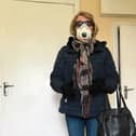 Bridie McMahon demonstrating the precautions she is taking before going out