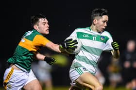 Limerick's Brian Foley carries possession past this Kerry challenge