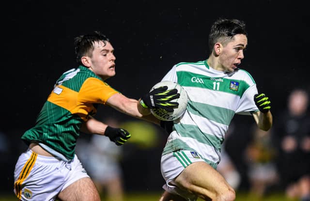 Limerick's Brian Foley carries possession past this Kerry challenge