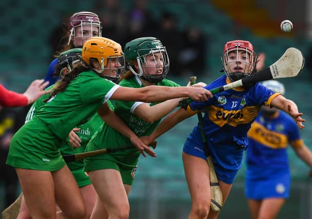 Limerick's Noirin Lenihan and Muireann Creamer attempt to win possession ahead of Karin Blair of Tipperary PIC: Sportsfile
