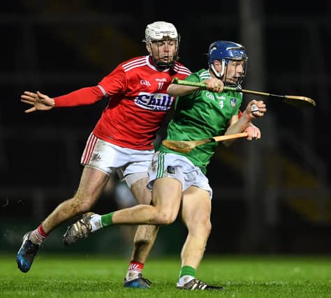 Limerick's David Reidy gets away from Luke Meade, of Cork, during the Co-Op Superstores Munster Hurling League final played at the LIT Gaelic Grounds on Saturday night
