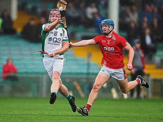 Ross Griffin Ballybrown under pressure from Doon's Mikey O'Brien during last weekend's county quarter finals