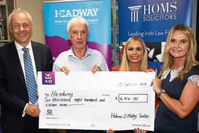 Robert Bourke and Sarah Falvey, Holmes O'Malley Sexton, presenting the donation to Kieran Loughran and Rella Galvin, Headway PICTURE: Adrian Butler