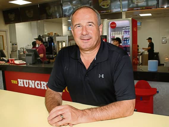 Businessman John Lyons in one of his new outlets