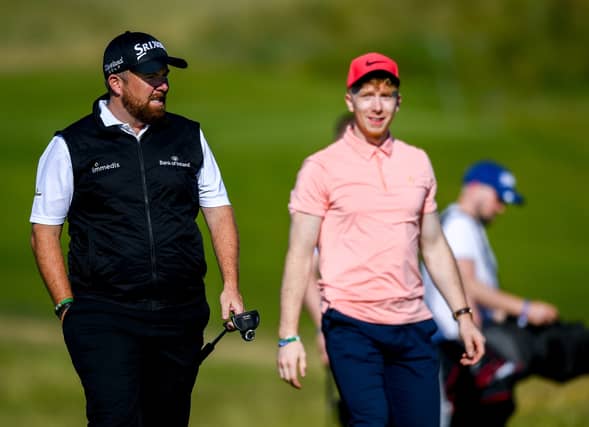 Limerick hurler Cian Lynch, right, and leading Irish professional Shane Lowry pictured during Wednesday's Pro Am at the Dubai Duty Free Irish Open at Lahinch Golf Club