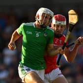 Rory Duff of Limerick in action against Conor O'Callaghan of Cork