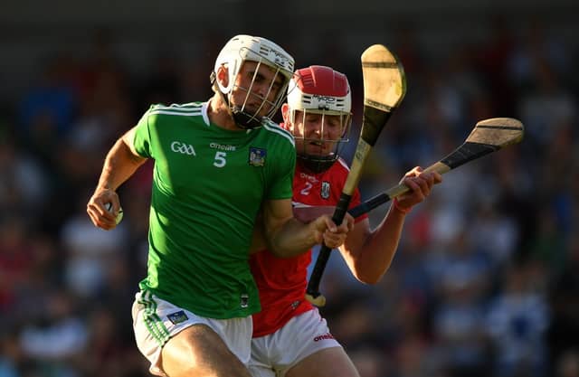 Rory Duff of Limerick in action against Conor O'Callaghan of Cork