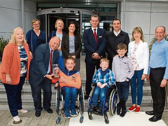 Eugene Phelan, editor Limerick Leader, presenting the Limerick Person of the Month award to Sean Byrnes with family, friends, Cllr James Collins, Mary Riordan, Southern, and Pat Reddan, Clayton Hotel