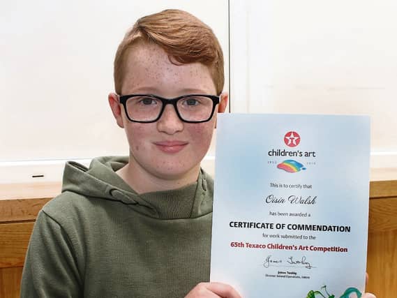 Oisin Walsh with his certificate from the Texaco Children's Art award
