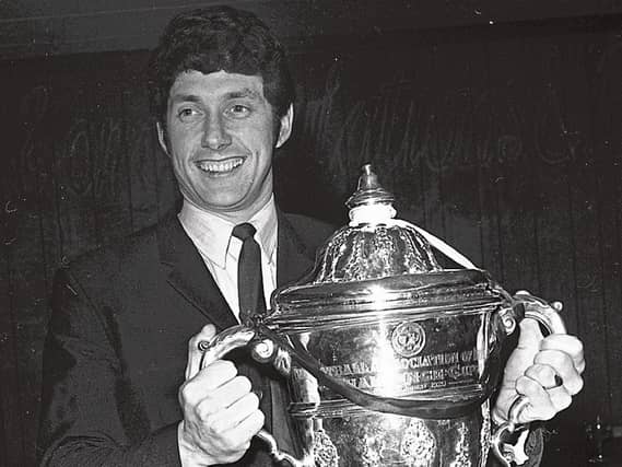 Limerick FC's Al Finucane arrives in Limerick with the FAI cup in 1971 . The following season, they took on Torino in the European Cup Winners Cup