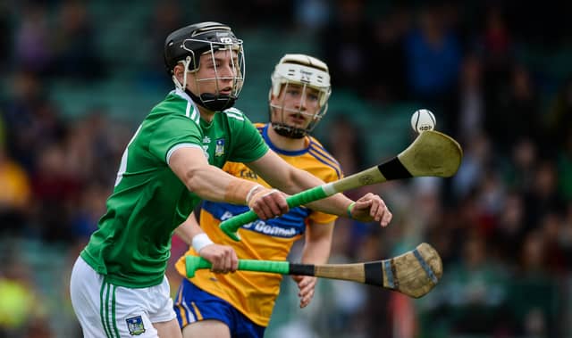 Limerick's Aidan O'Connor wins possession ahead of Oisin Clune, of Clare, during the Electric Ireland Munster minor hurling championship game at the Gaelic Grounds on Sunday