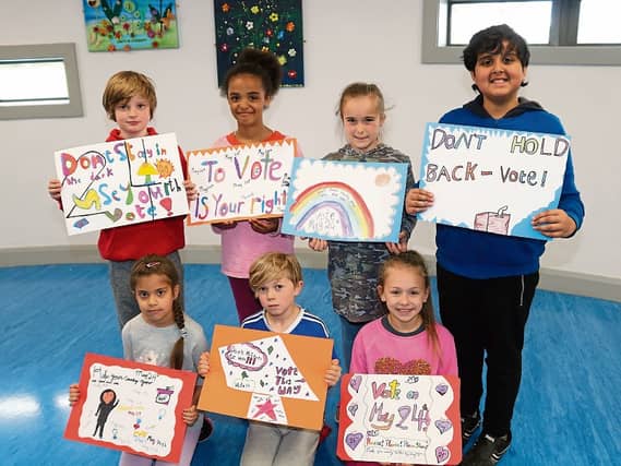 Pupils from Educate Together in Mungret with their posters asking people to vote Picture: Michael Cowhey.