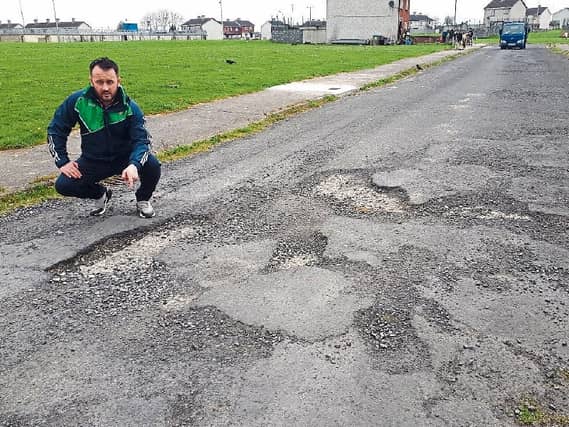 Election candidate Dean Quinn pointing out the poor state of this road in Moyross