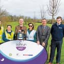 Cllr Daniel Butler, mayor of the metropolitan district, accepts the defibrillator which was donated by Fleming Medical. Also pictured  Mark Fleming, founder of Fleming Medical and local volunteers