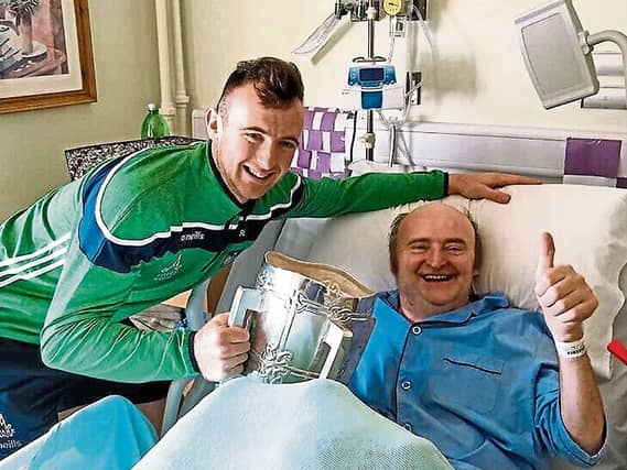 Richie and Paddy English with the Liam MacCarthy Cup