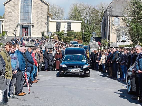 Limerick hurlers and management join Doon GAA Club in the guard of honour for the late Paddy English