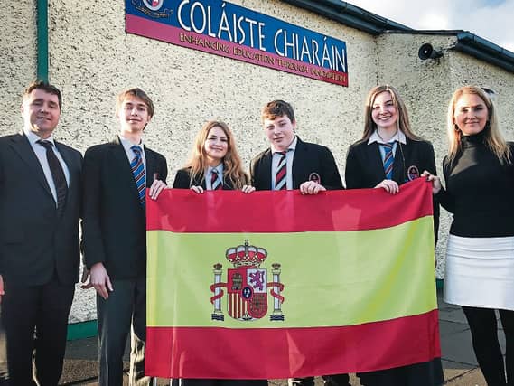 Acting Principal, Mr. Gerard O'Sullivan and Ms. Sara Martinez pictured with Students at the launch of the DELE centre in Colaiste Chiarain