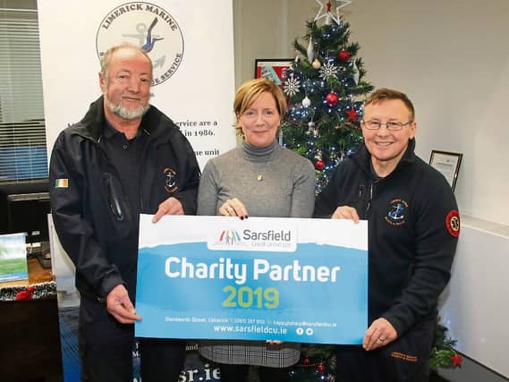 Kate McGrath, Sarsfield Credit Union with Terry Logan and Tony Cusack, Limerick Marine Search and Rescue Picture: Adrian Butler