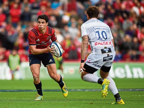 Munster's Joey Carbery attempts to get by Danny Cipriani when the sides met in round two