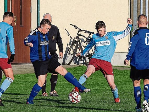 Hyde Rangers' Brian Slattery and Prospect Priory's Derek Hanlon tussle for possession during their Munster Junior Cup clash last Sunday morning Picture: Dermot Lynch