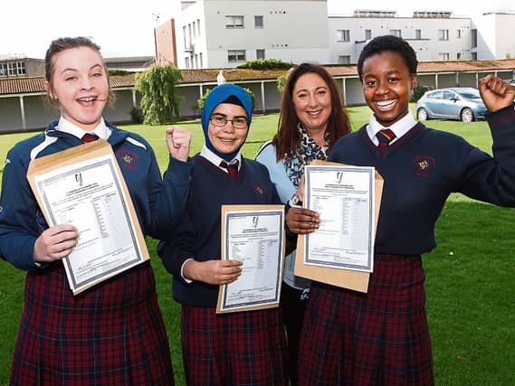 Art Teacher Sarah Nestor with Abbey O'Keeffe, Zohra Koohestani and Nancy Ekhator who got their Junior Certificate exam results at Coláiste Nano NaglePicture: Dave Gaynor