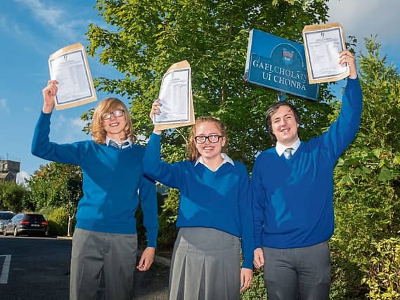 Gaelcoláiste Uí Chonbá students Cian Masún, Melissa Ní Fhlaitheartaigh and Cian Ó'Nuallaín celebrating their Junior Certificate results at Desmond College, Newcastle West Picture: Marie Keating