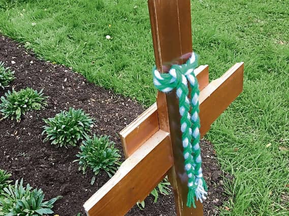 The grave in Adare of Tom English, who died six months ago, was adorned with a braid in the green-and-white of Limerick the day before the match, which was his wedding anniversary