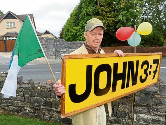 Frank Hogan ‘John 3:7’ with his famous yellow sign on his 80th Birthday Picture: Michael Cowhey